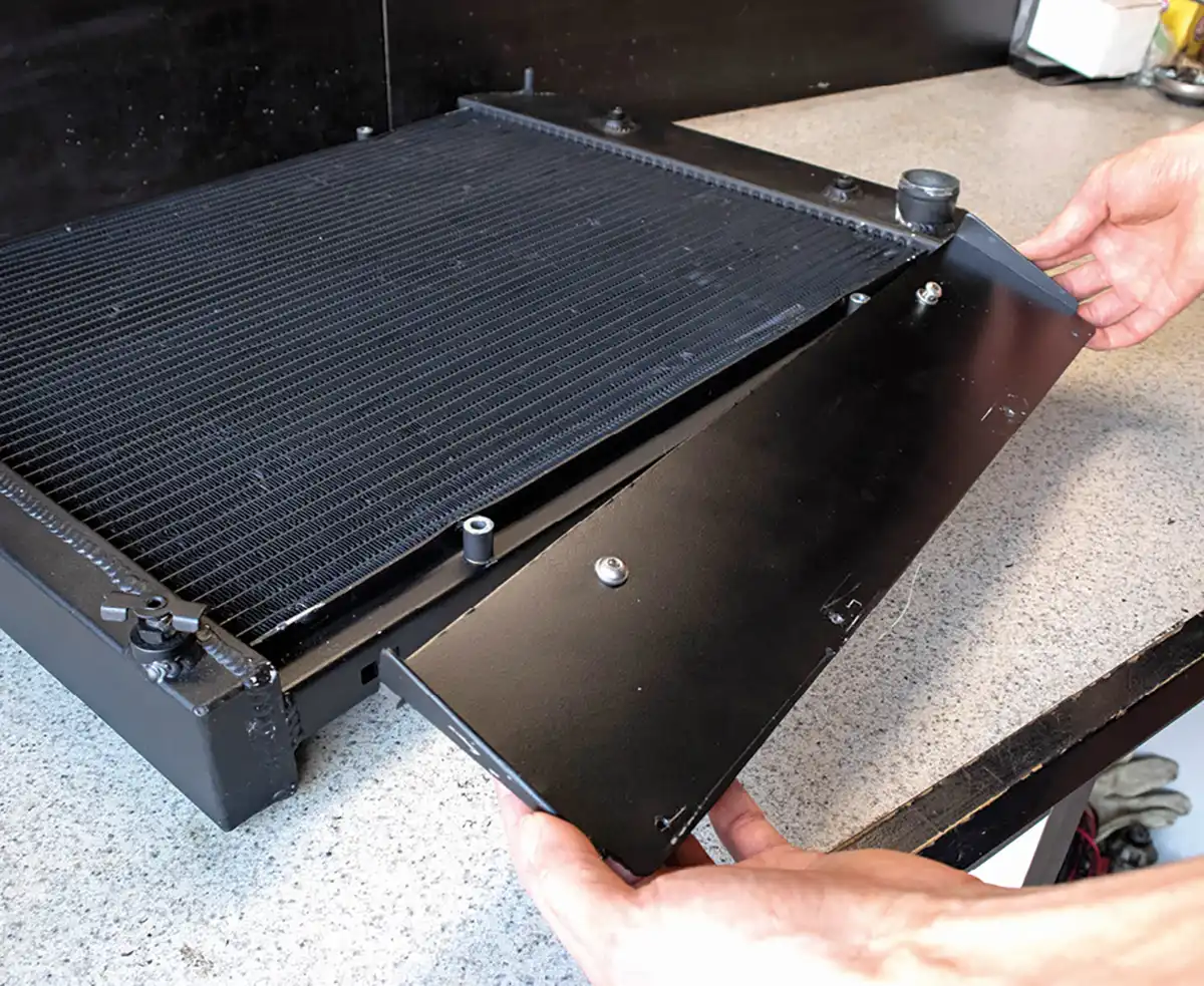 To keep the fan from sucking the wrong air, we made a lower mounting plate that doubled as a block-off plate to seal the bottom of the shroud.