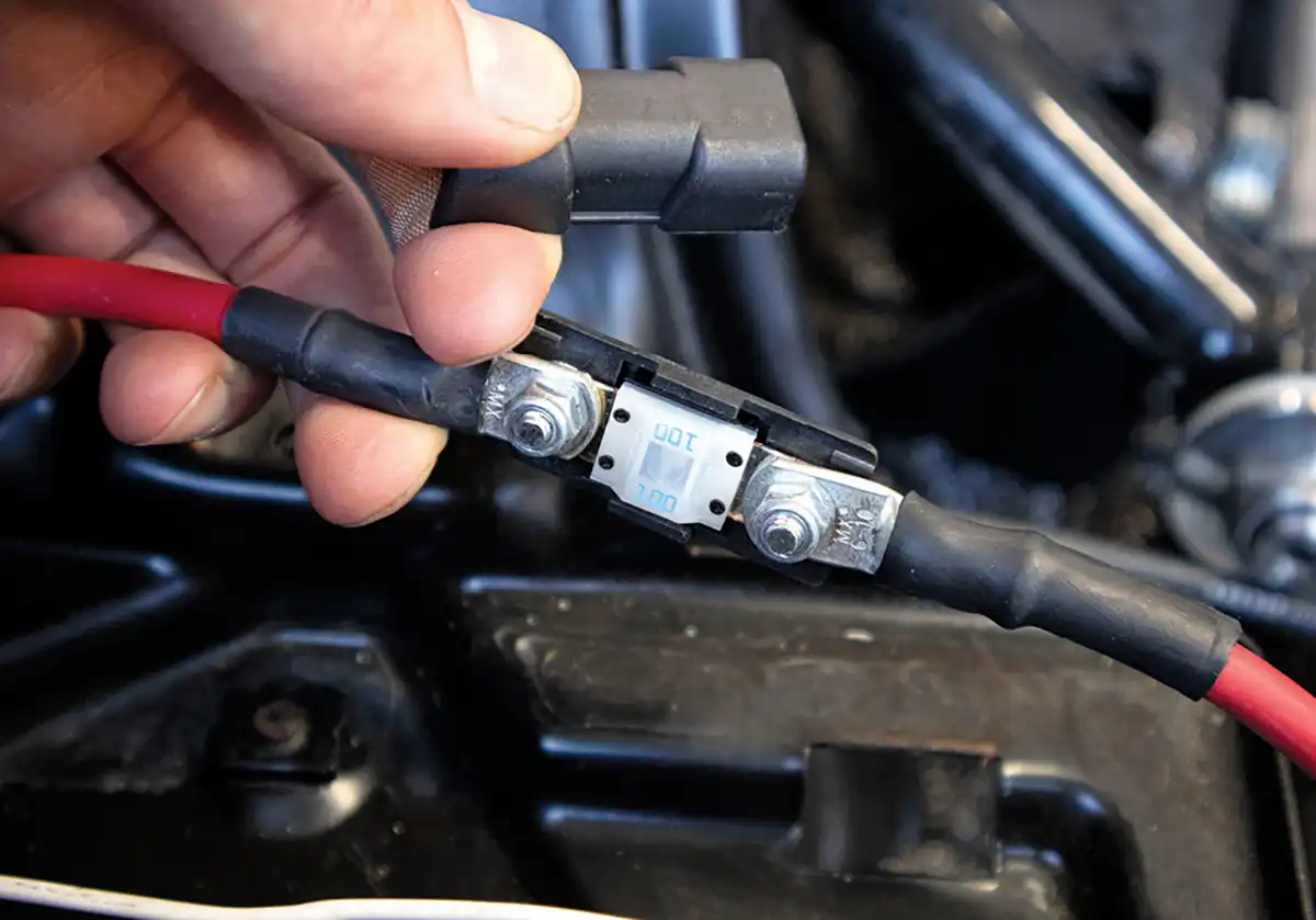 For the fan power harness, we ran the supplied six-gauge positive cable and 100A Midi fuse to the power junction block behind the battery.