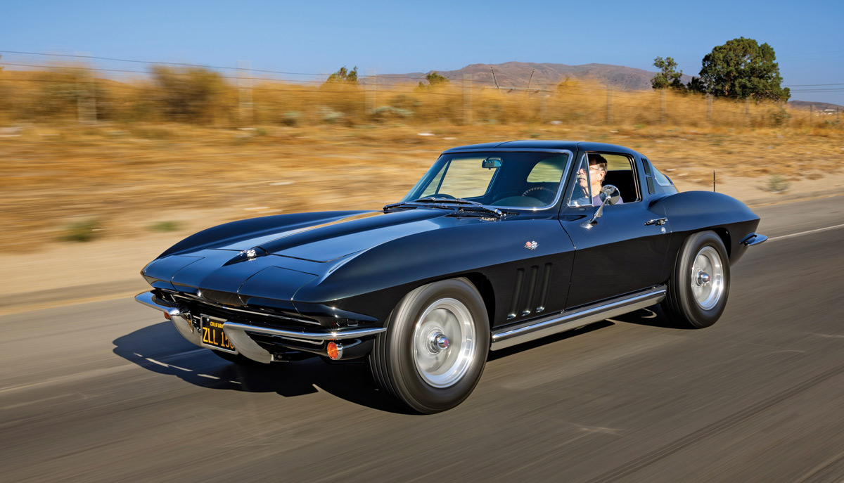 man driving a ’65 Corvette