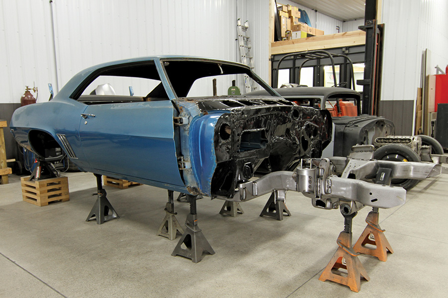 elevated blue car missing front half of car