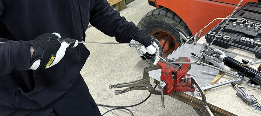 close up of hands working on a hard line