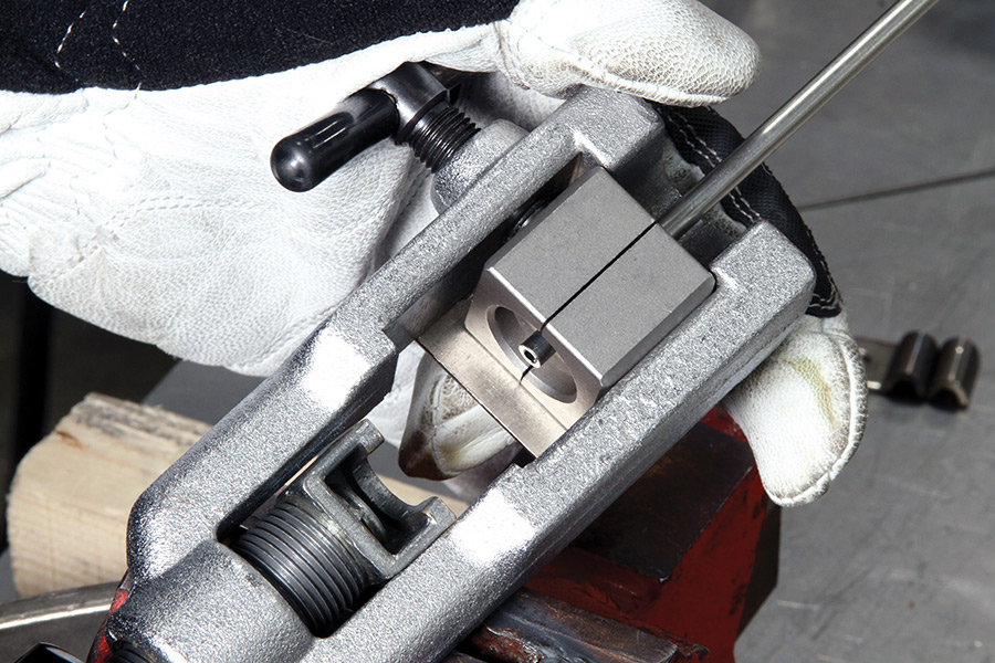 Hand positioning brake line so that its end is parallel with the end of the die.