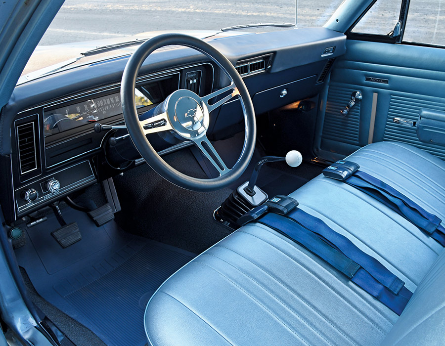 view of fronts seats and steering wheel of blue '69 nova