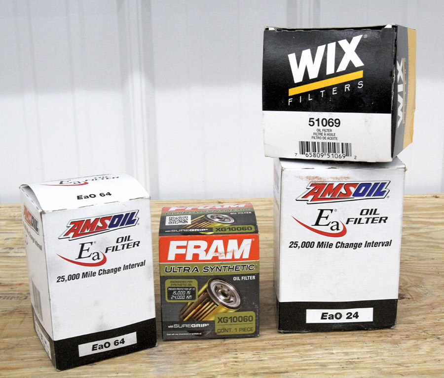 boxes of engine filters on a wooden table