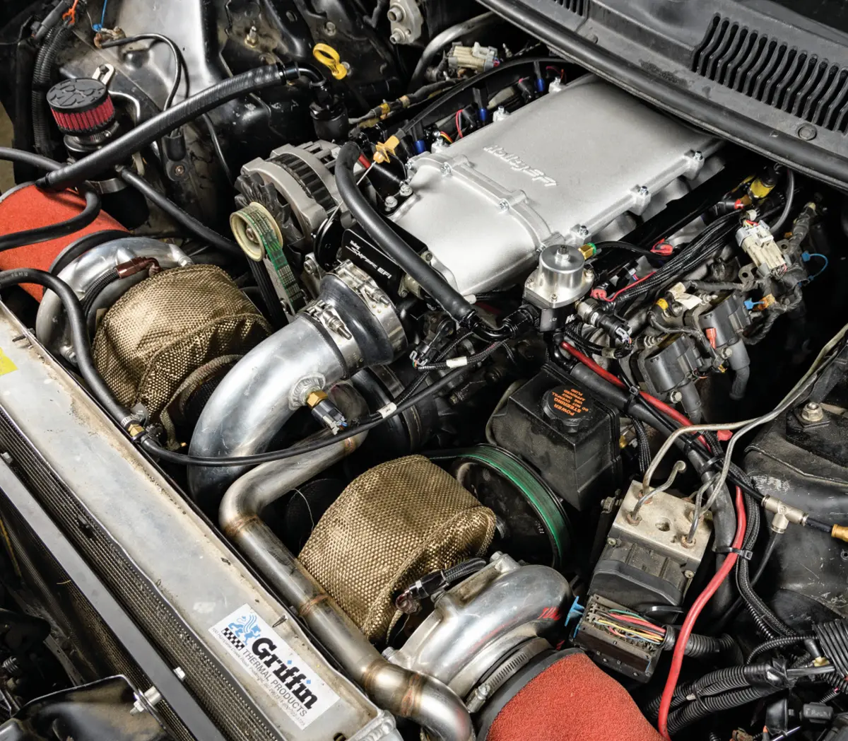 angled view under the hood of the twin-turbo Camaro with the new Holley Lo-Ram manifold intake installed