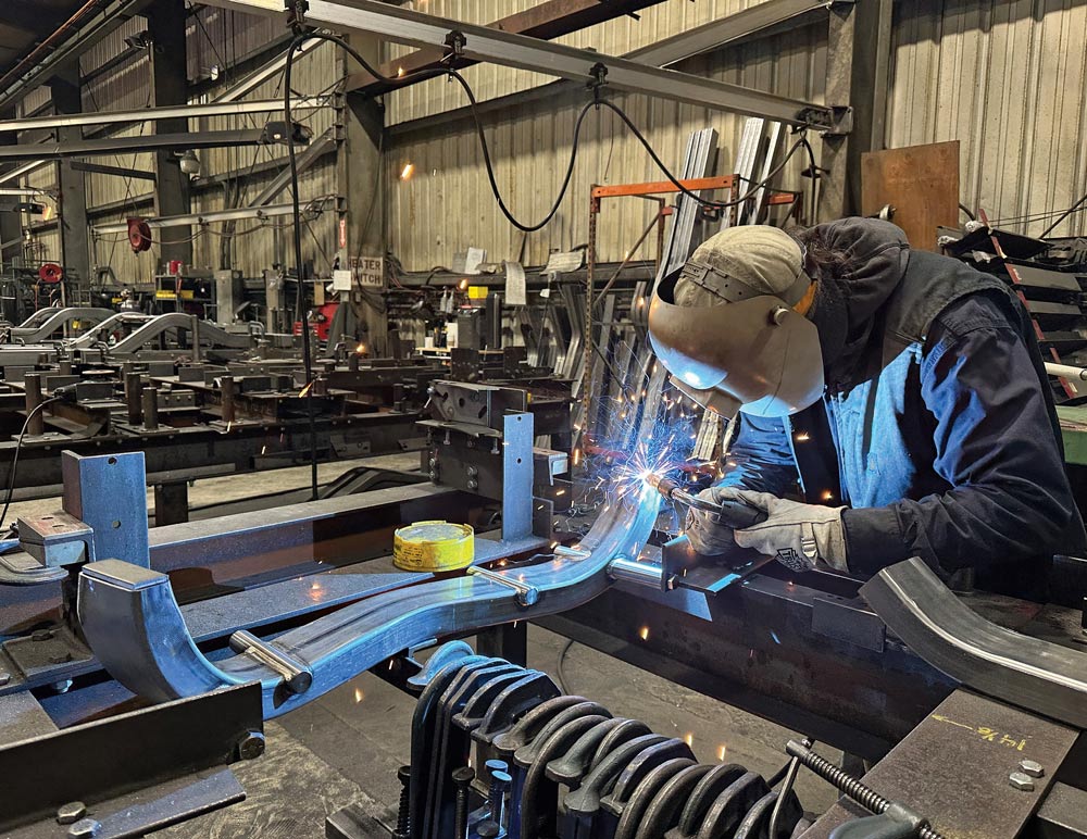 welder in action while wearing a mask