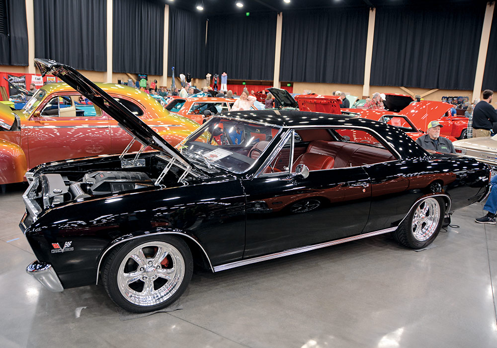 shiny black car with hood open 