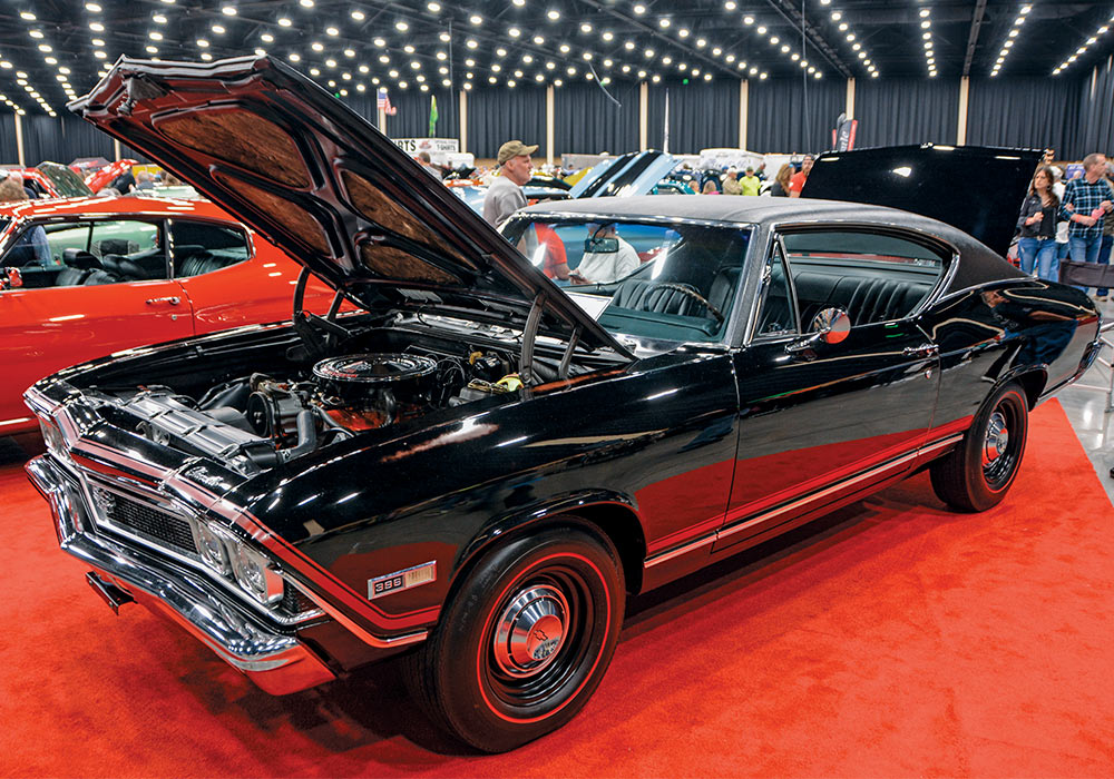 shiny black car with hood open 