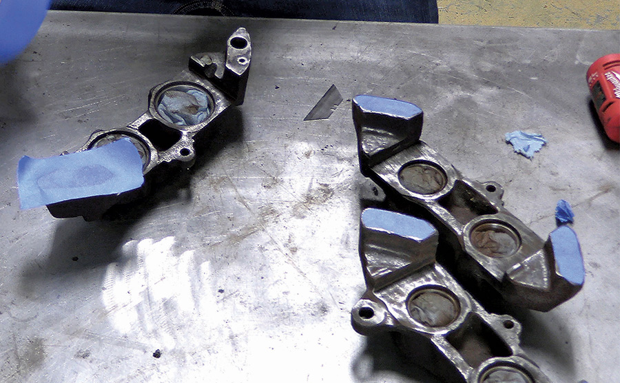 painter's tape protecting parts of caliper
