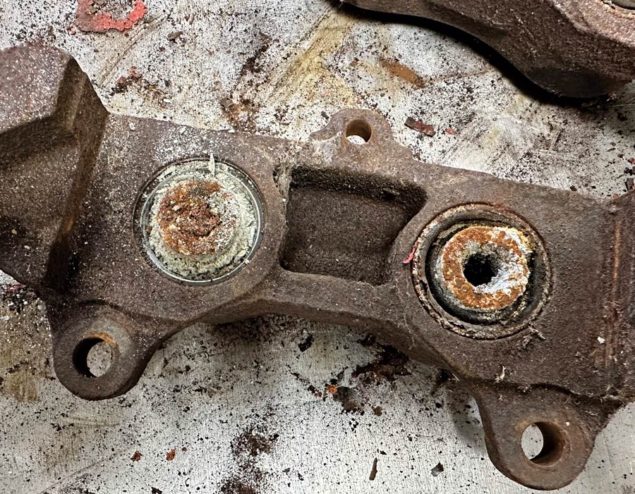 caliper pistons with dried out brake fluid covering them