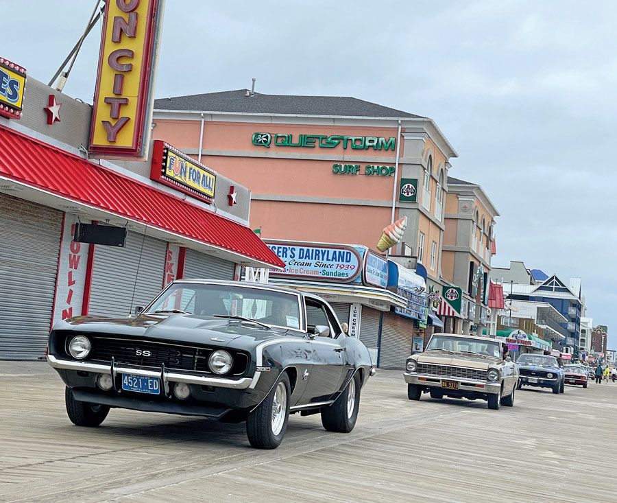 cars driving on boardwalk  
