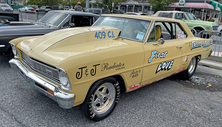 yellow-beige car with various decals 