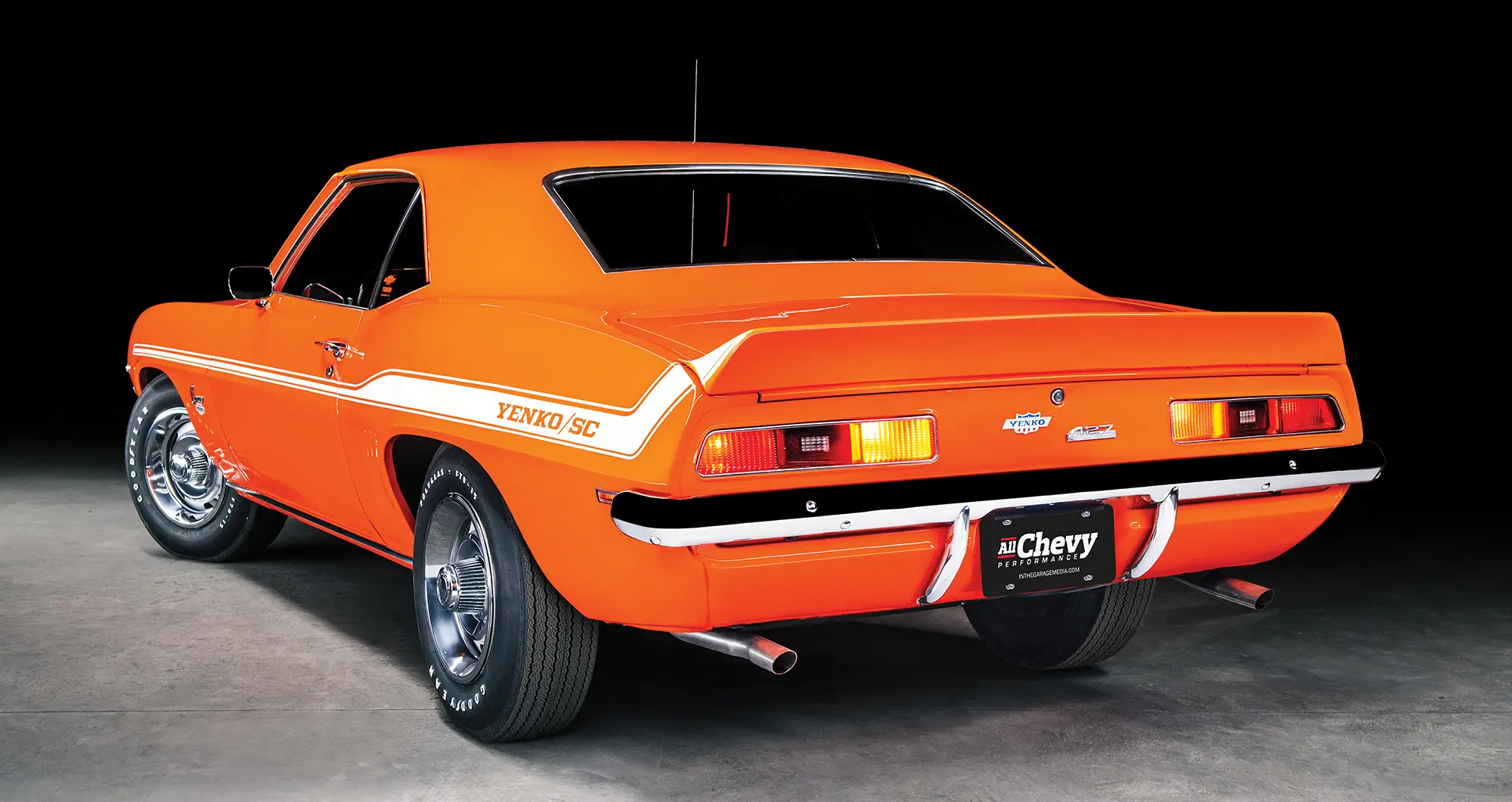 3/4 view of orange '69 Yenko Camaro from rear