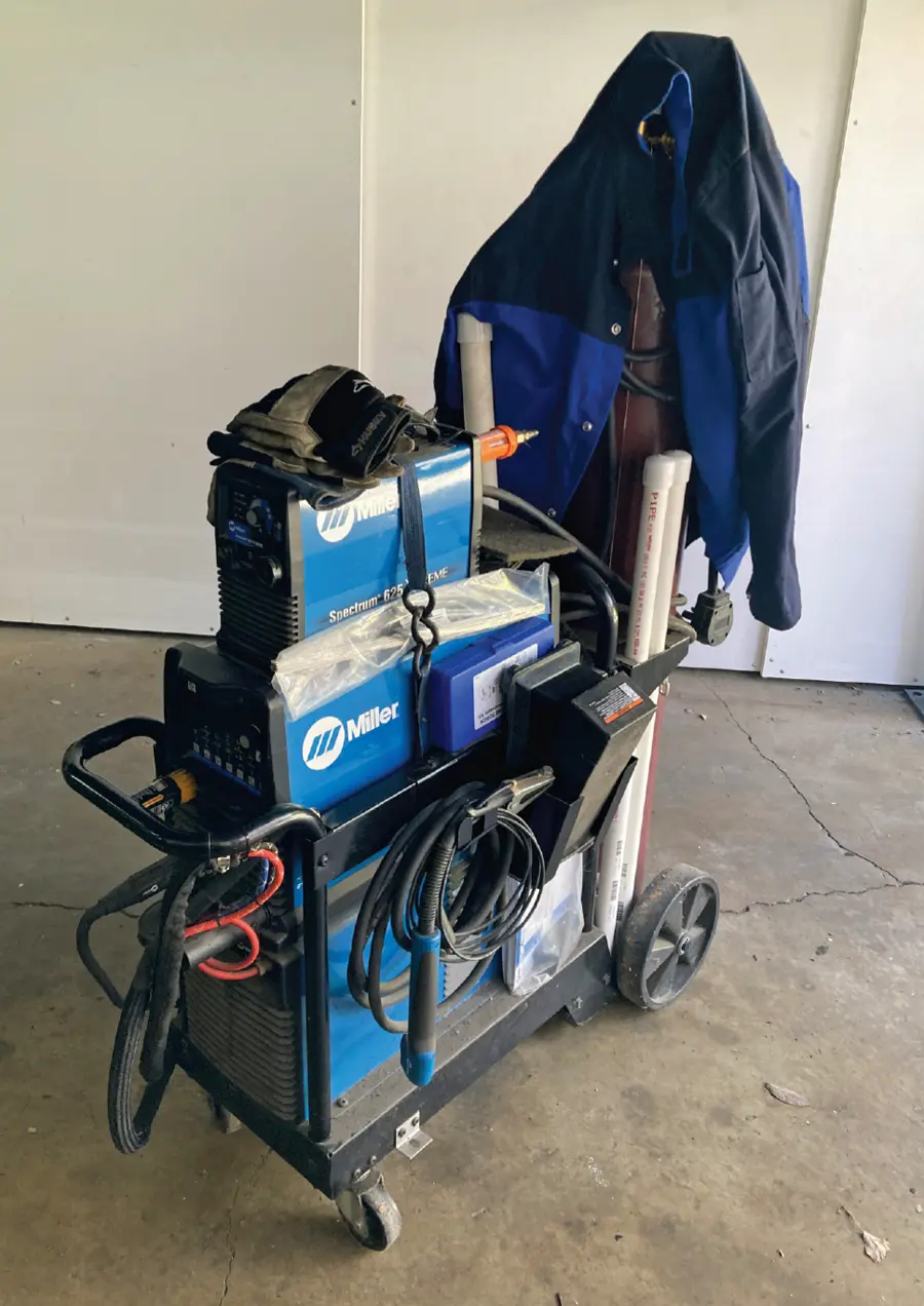full view of a TIG welding cart including the tools needed to lay a bead