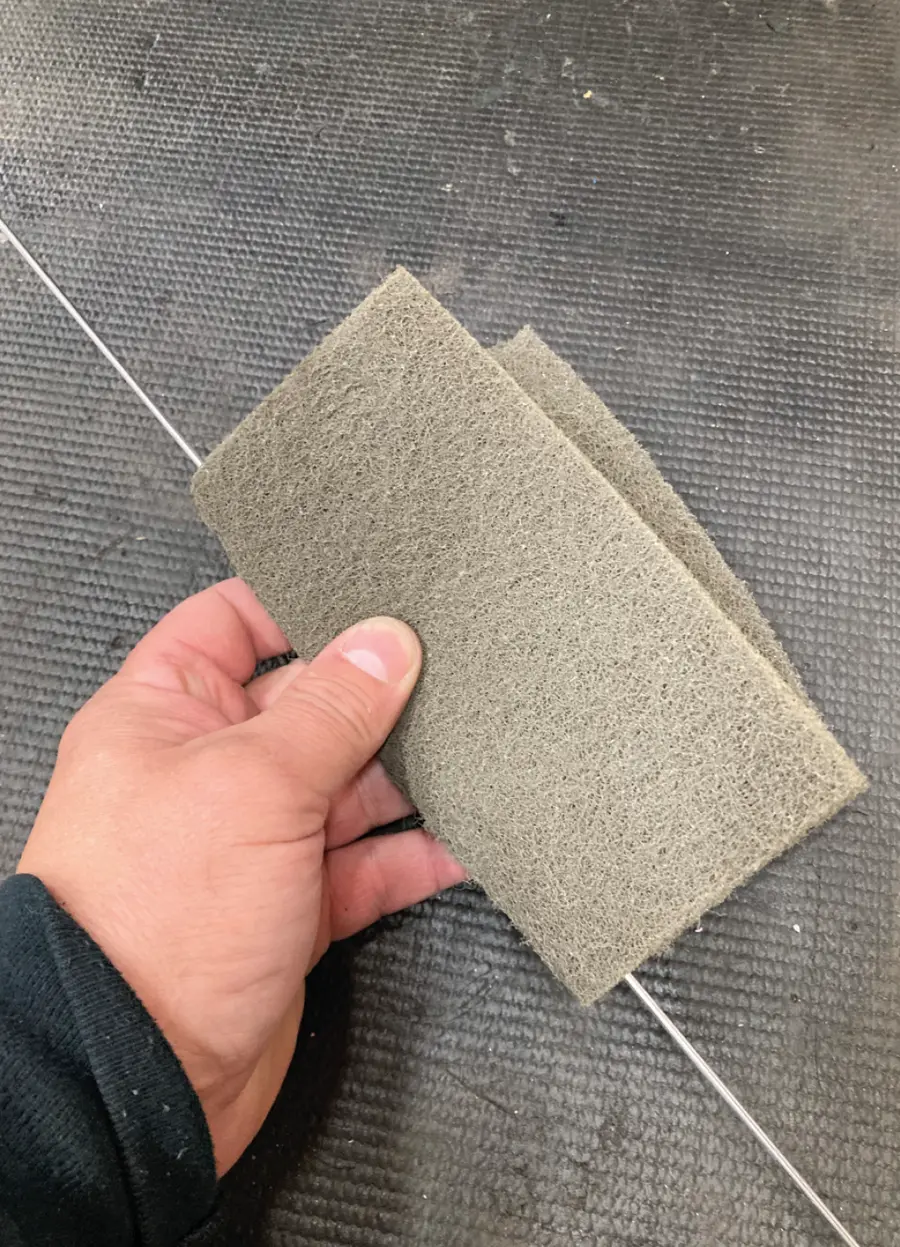 an aluminum filler rod is thoroughly cleaned with a Scotch-Brite pad
