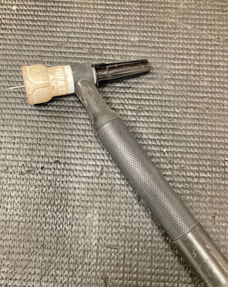 top view of a #12 FUPA cup and a medium length back cap placed on a work surface