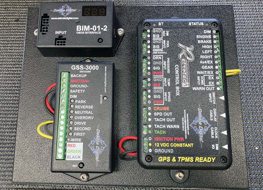 Close-up of the Dakota Digital control box and OBDII interface ready for integration into a 1957 Chevy