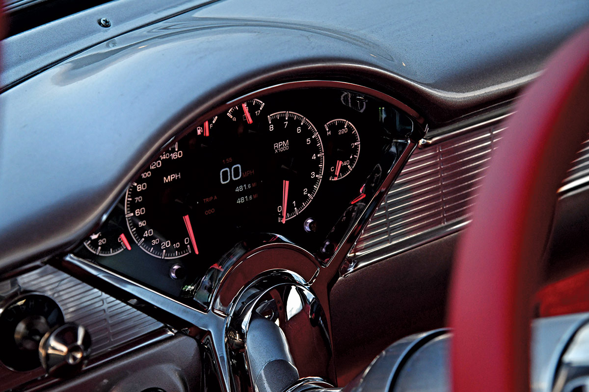 Classic 1955 Chevy Bel Air dashboard with modern digital gauges and vintage-inspired chrome trim