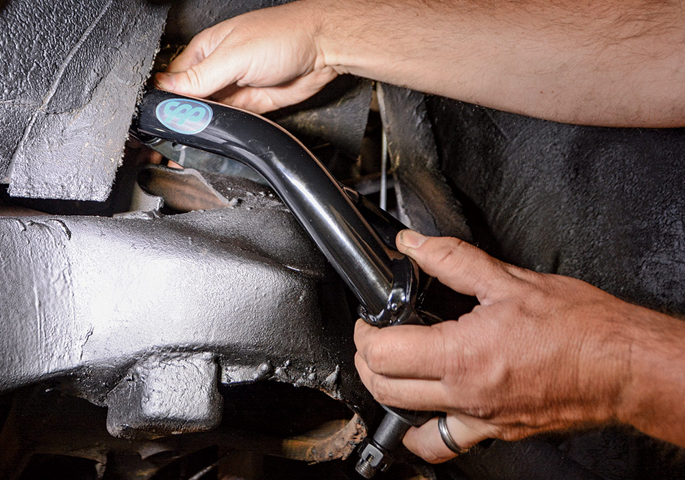 Fitment of the upper control arms is just like the originals. We position it and then install the new studs and nuts