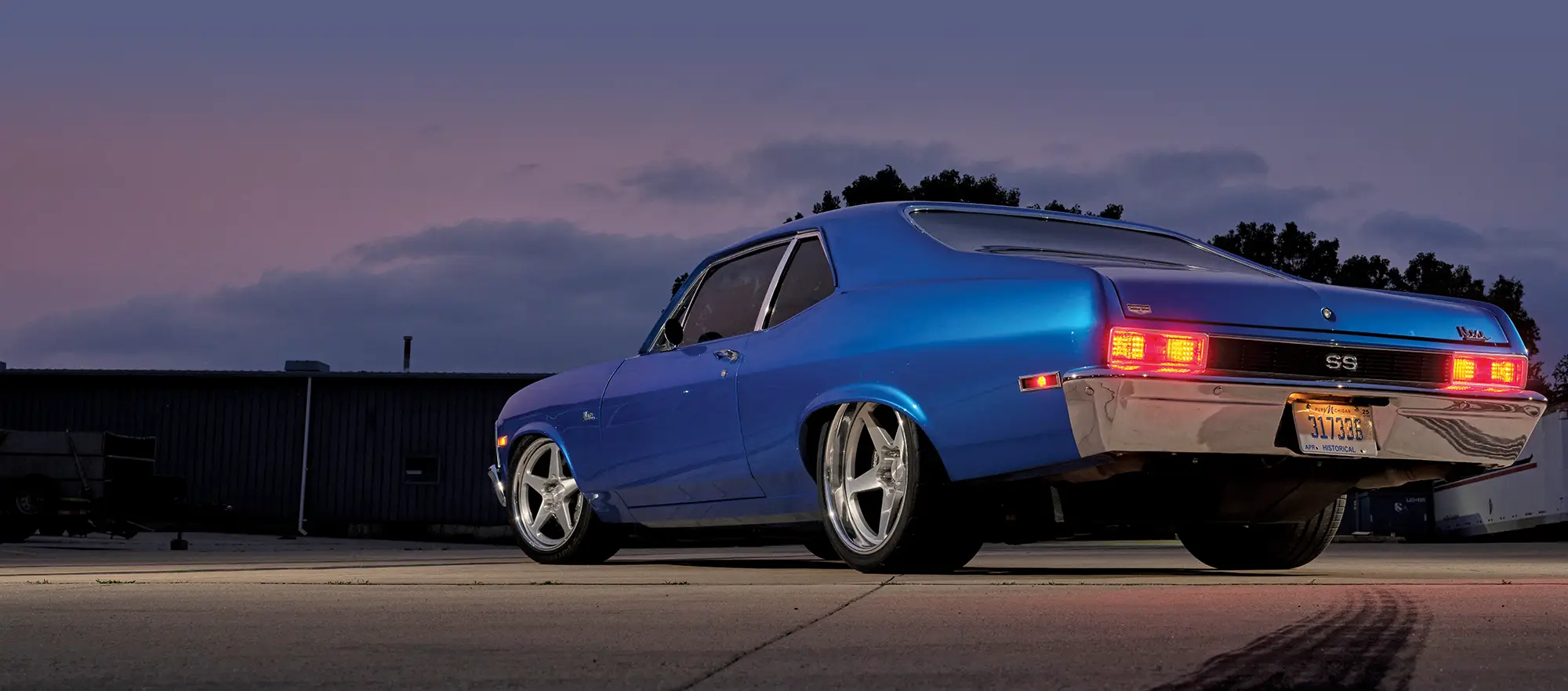 Engine bay of the 1971 Chevrolet Nova SS, featuring a modern LS swap with black and chrome detailing