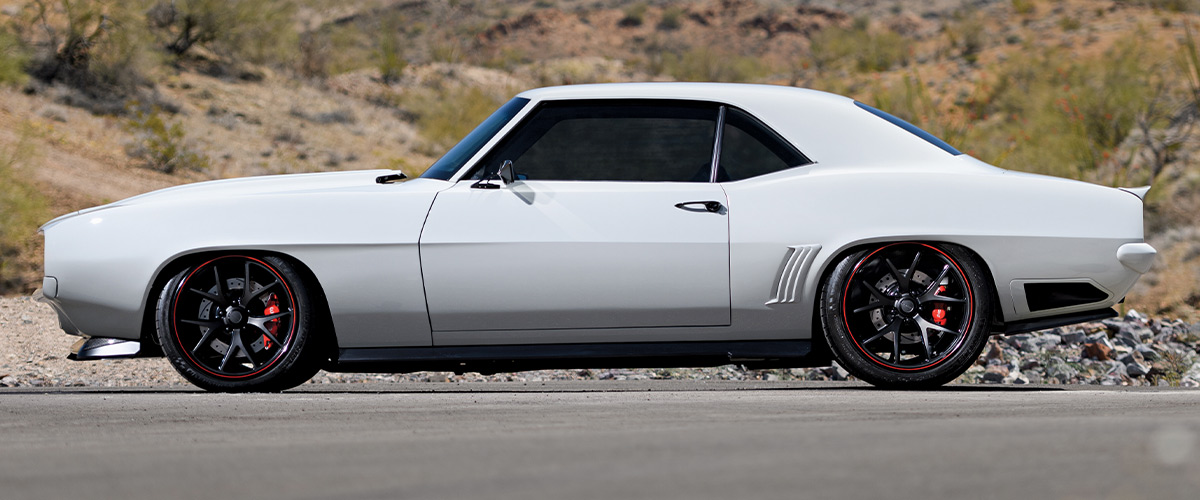 Side profile of the 1969 Camaro Z28, emphasizing the lowered stance and custom wheels