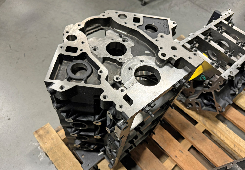 Top view of a BluePrint engine block on a pallet, showcasing the machined cylinder and mounting surfaces