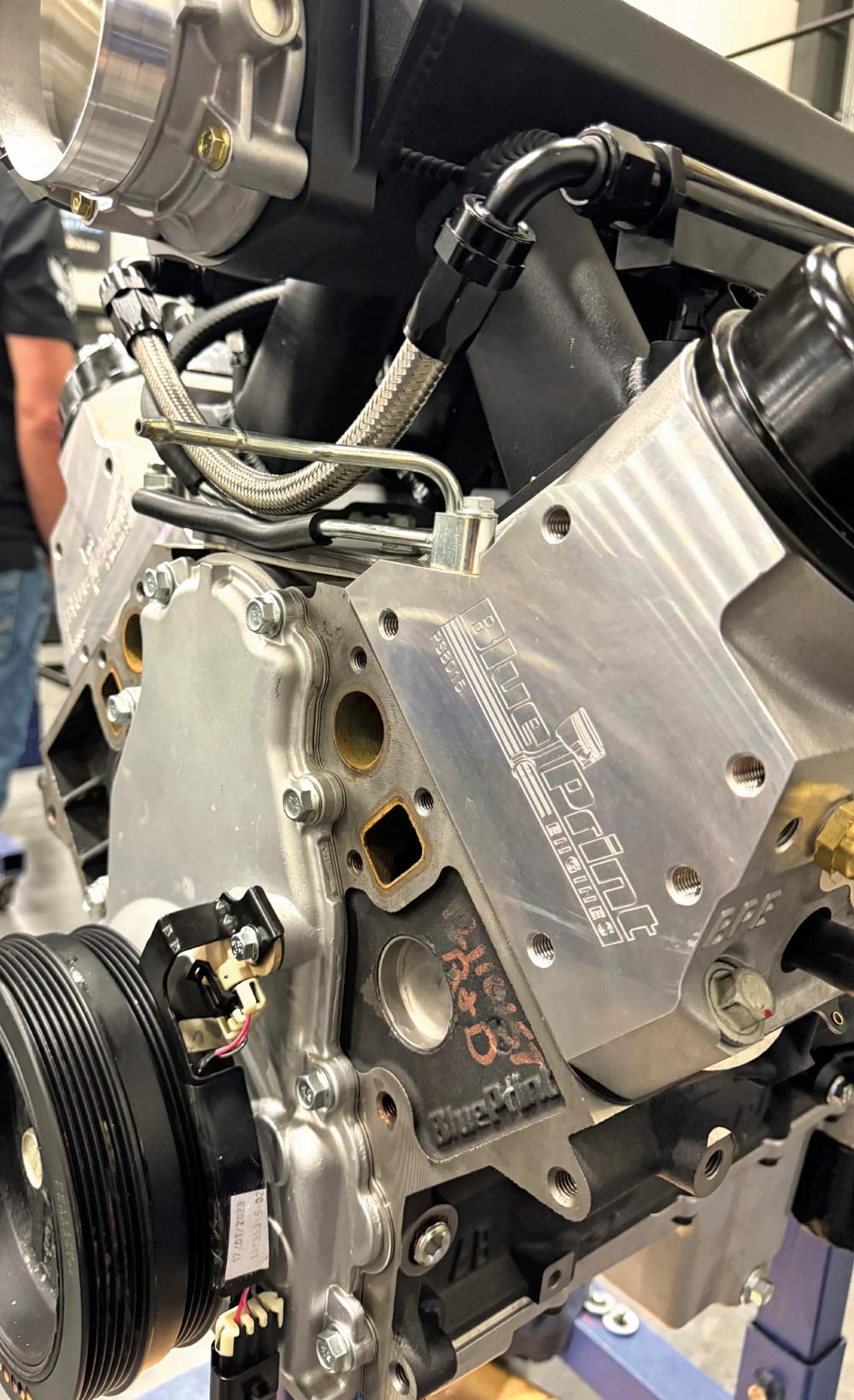 Side view of a BluePrint engine with the intake manifold installed, partially assembled in a workshop