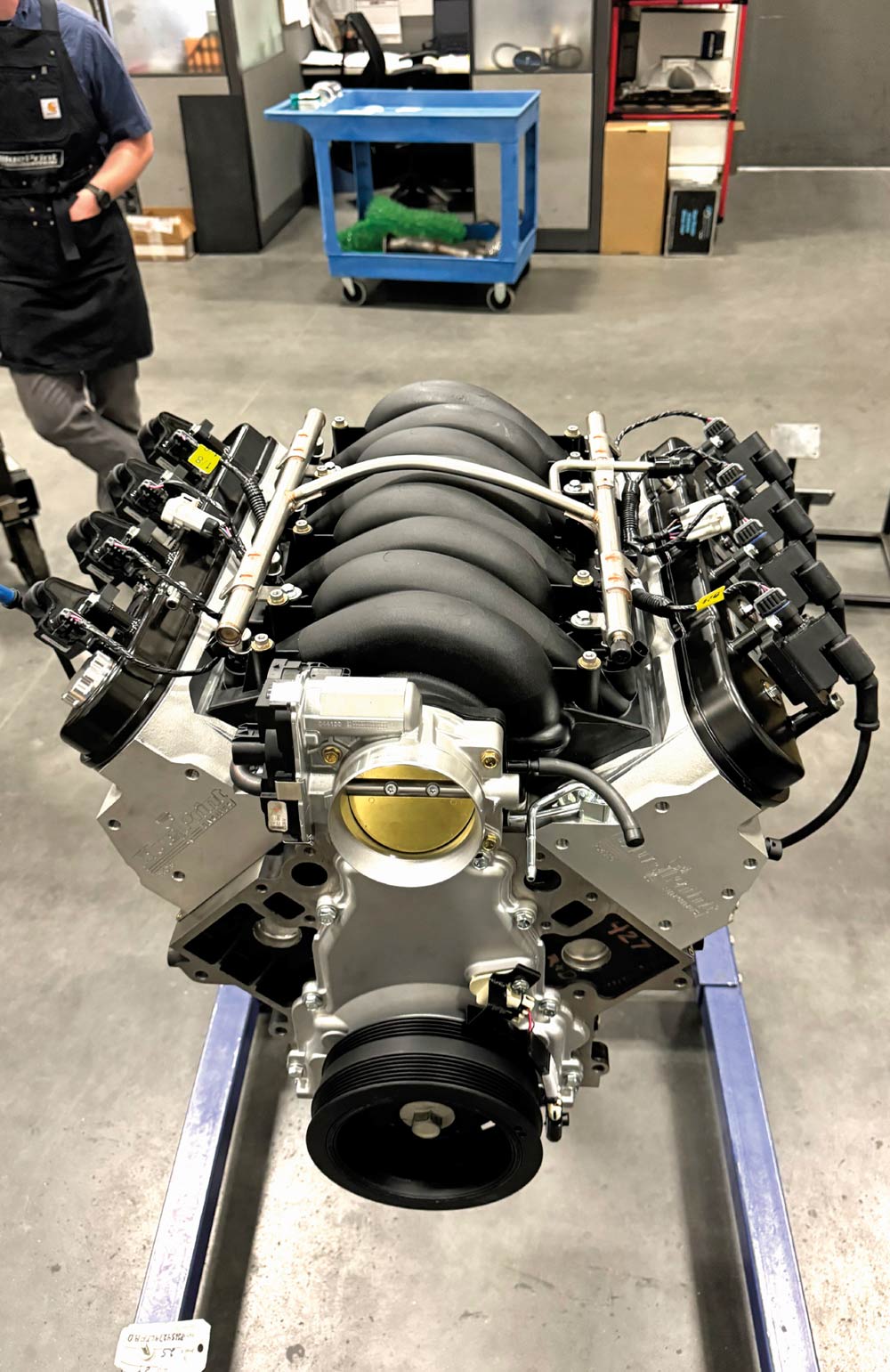 Overhead shot of an assembled BluePrint engine on a stand, with visible fuel injectors and intake system