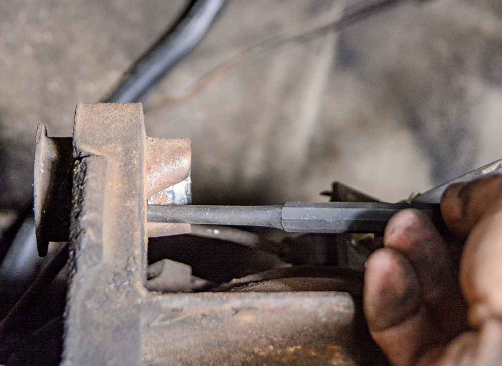 hand removing shell out of bushing housing