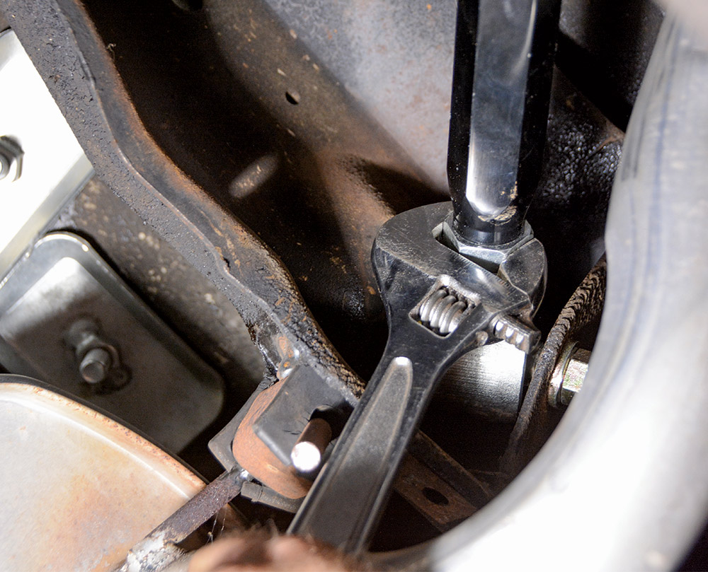 closeup of wrench tightening bolt