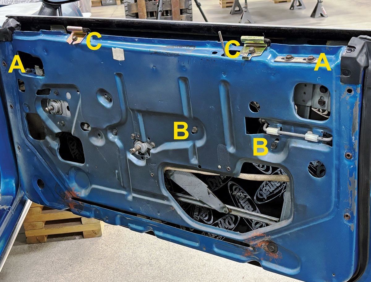 yellow capital letters labeling the door's adjustment locations and functions