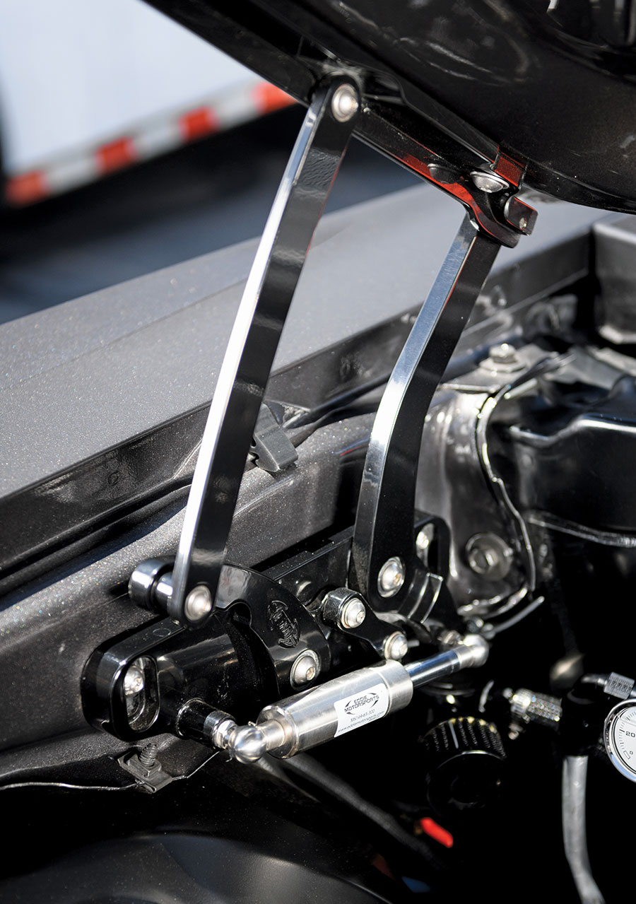 Detailed view of the custom hood hinge mechanism installed on the 1971 Chevrolet Nova