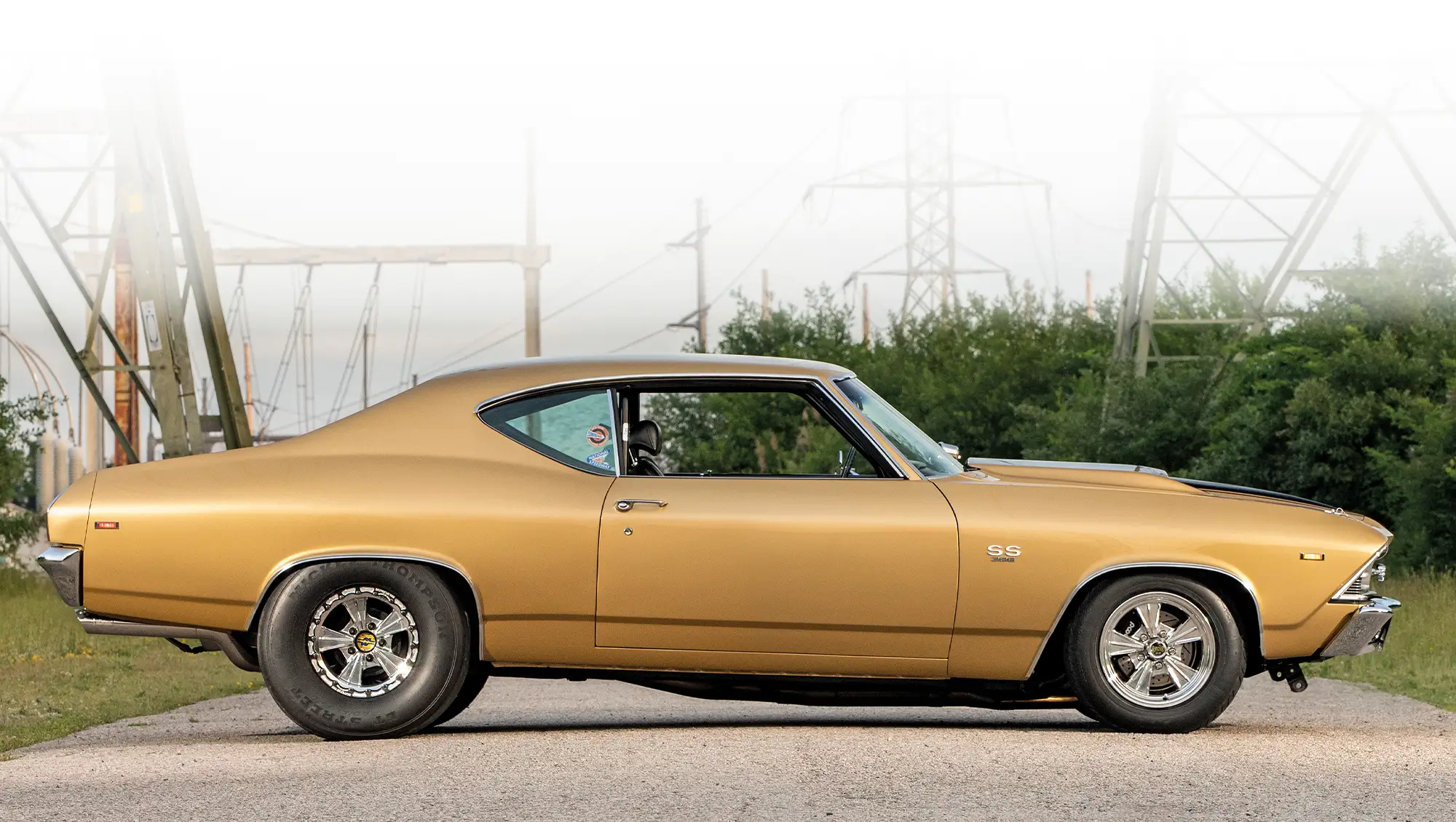 side profile of the 1969 Chevelle SS showcasing its sleek design and black SS emblems