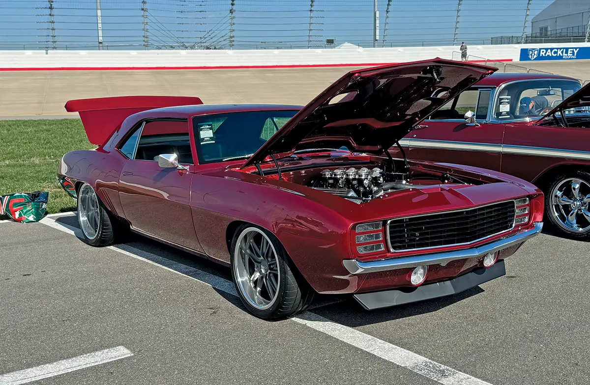 1969 Chevrolet Camaro maroon build with open hood and modern wheels at the Triple Crown of Rodding