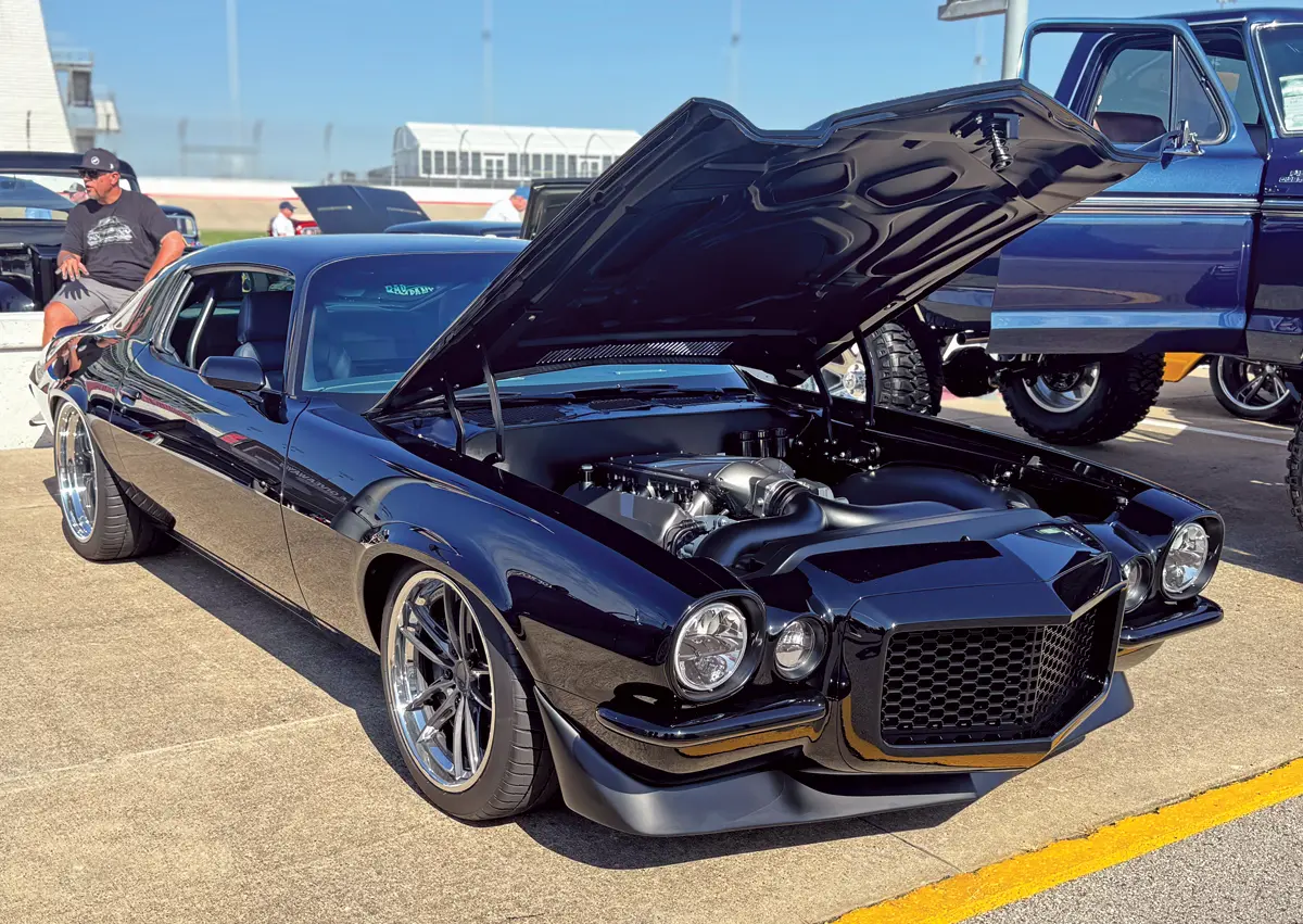1970 Chevrolet Camaro with widebody kit and custom engine build on display at event