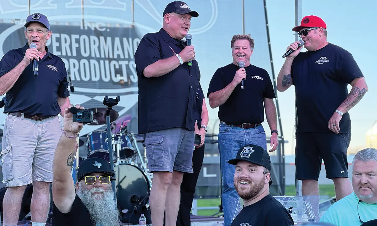 Car show stage event with automotive industry figures and hosts at the Triple Crown of Rodding