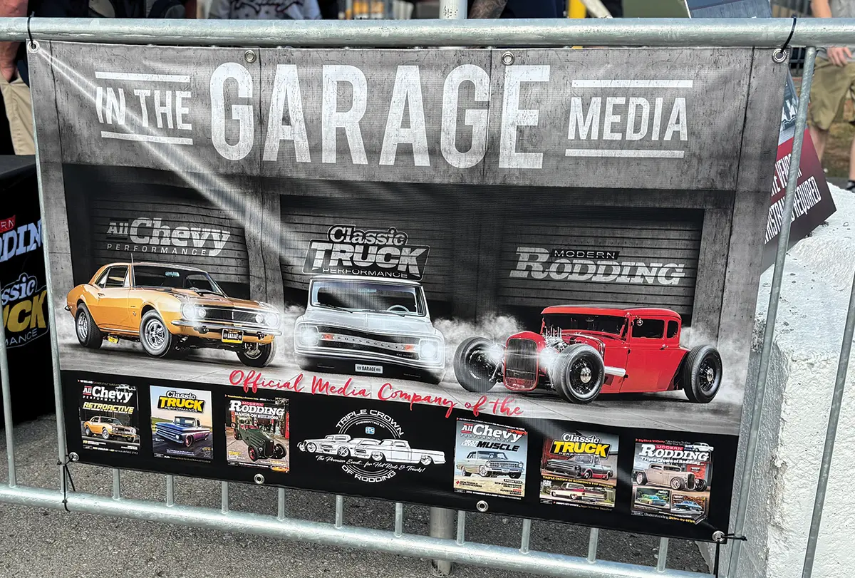 In The Garage Media booth featuring classic car magazines at the Triple Crown of Rodding