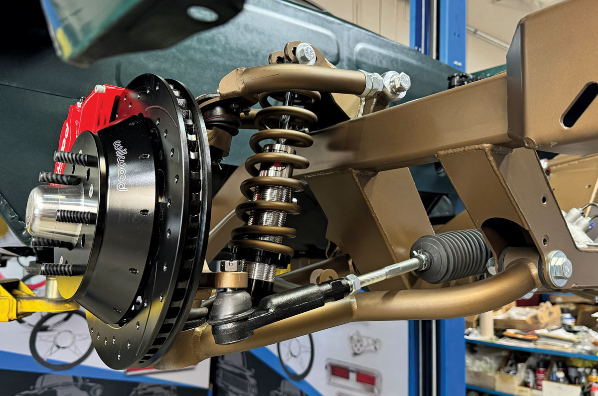 Custom-built Chevrolet V8 engine with bronze-finished valve covers and intake manifold ready for installation