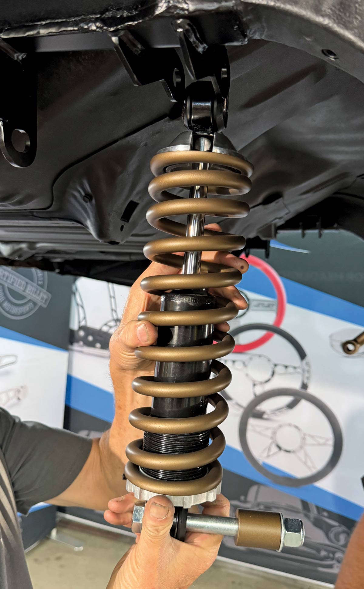 Mounting a coilover shock absorber on the rear suspension of a Chevrolet Nova for enhanced handling