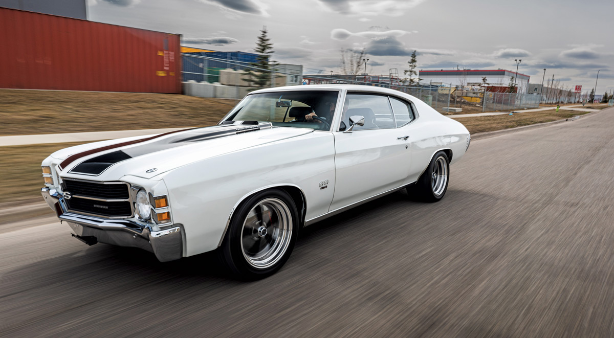 1971 Chevelle SS cruising on the road, highlighting its aggressive stance and performance wheels