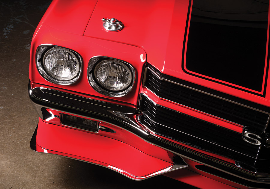 Front view of the 1970 Chevelle showing its dual headlights and chrome bumper with black racing stripes