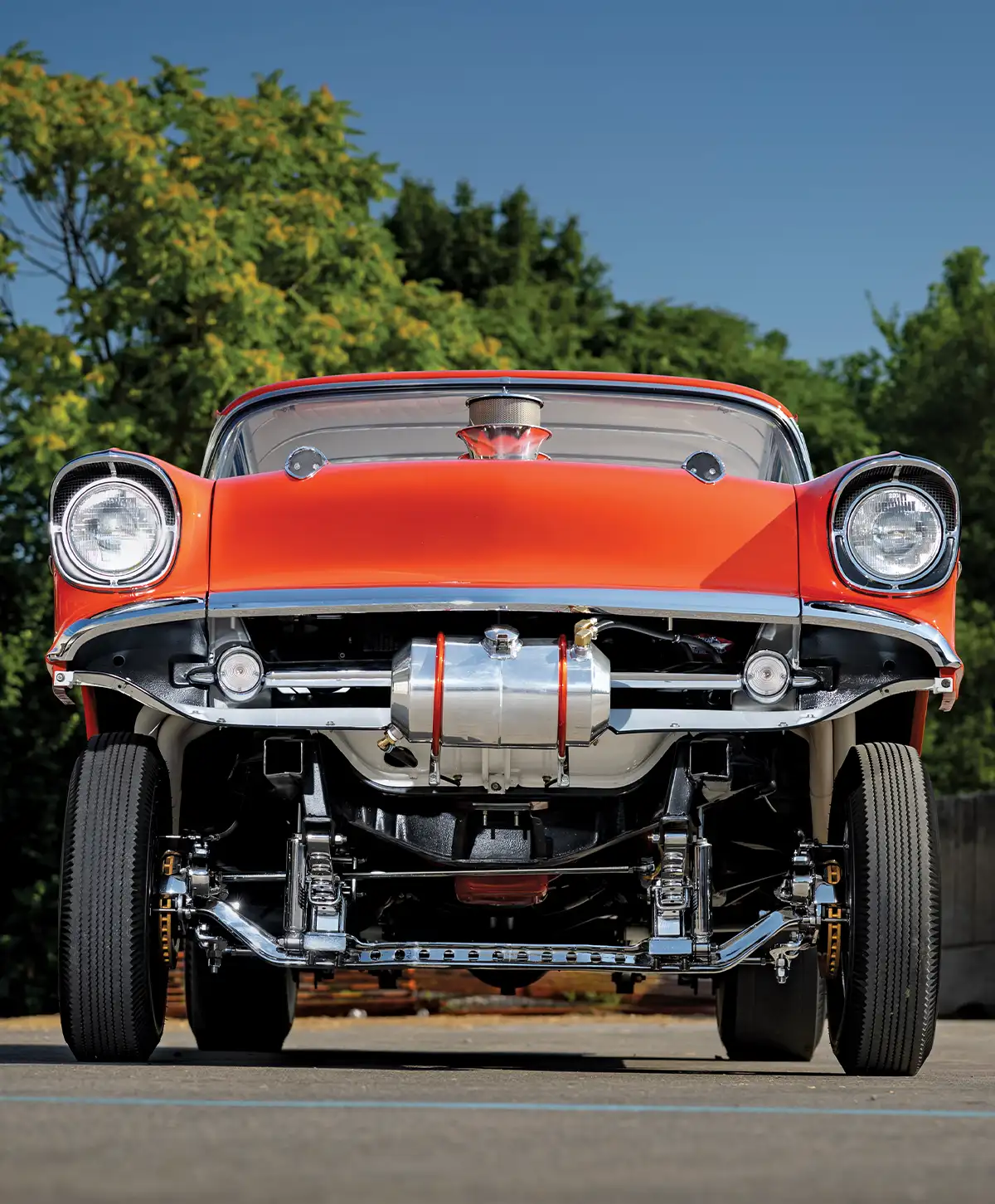 front view of a 1957 Chevy Bel-Air gasser showcasing the aggressive stance and detailed suspension components