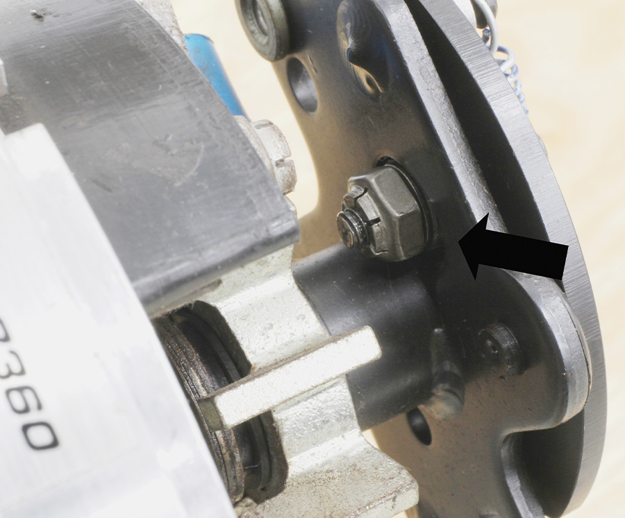 MSD distributor that uses a slot in the mechanical advance plate along with a bushing retained by the locking nut