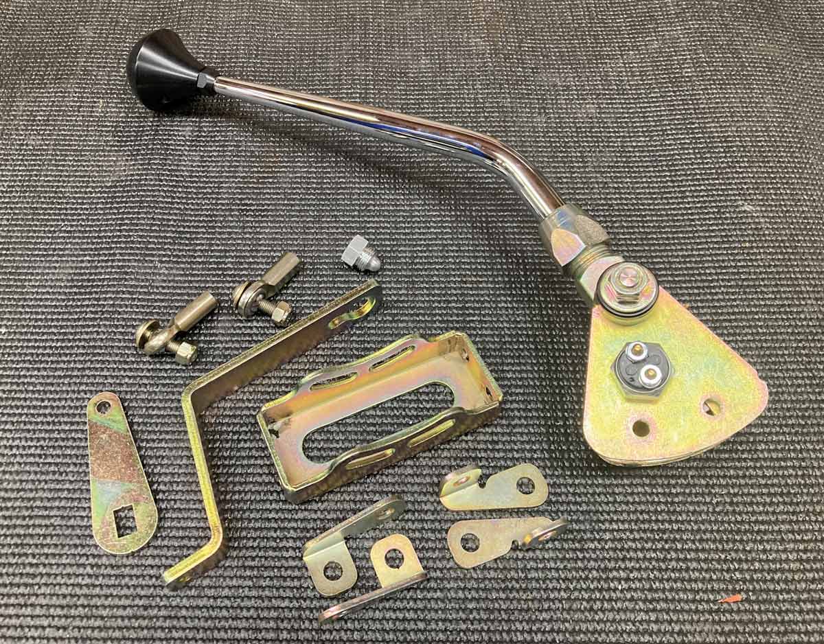 1957 Chevy Lokar shifter components including brackets and hardware for a complete and secure installation