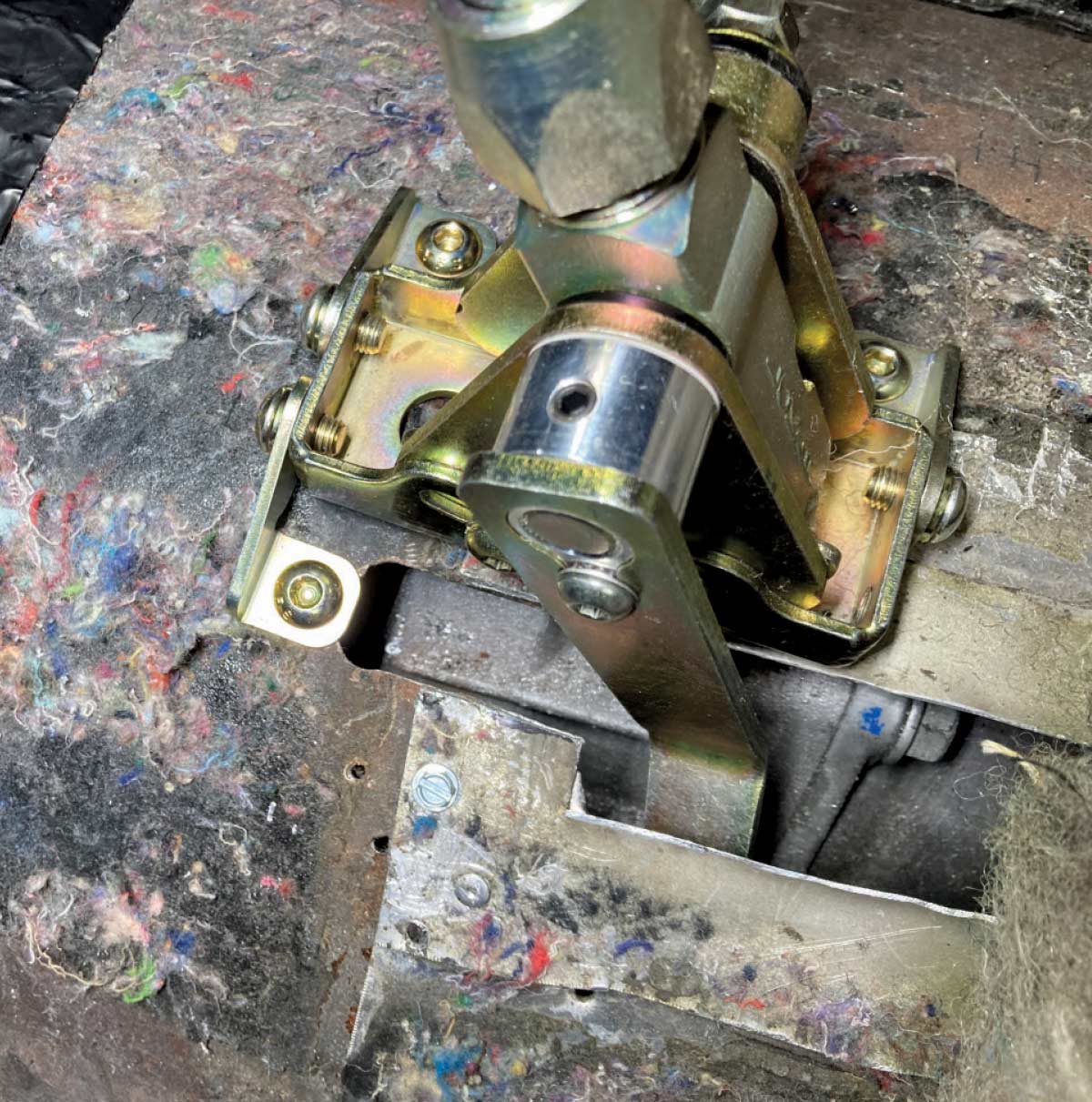 1957 Chevy Lokar shifter linkage and bracket detailed in undercarriage setup