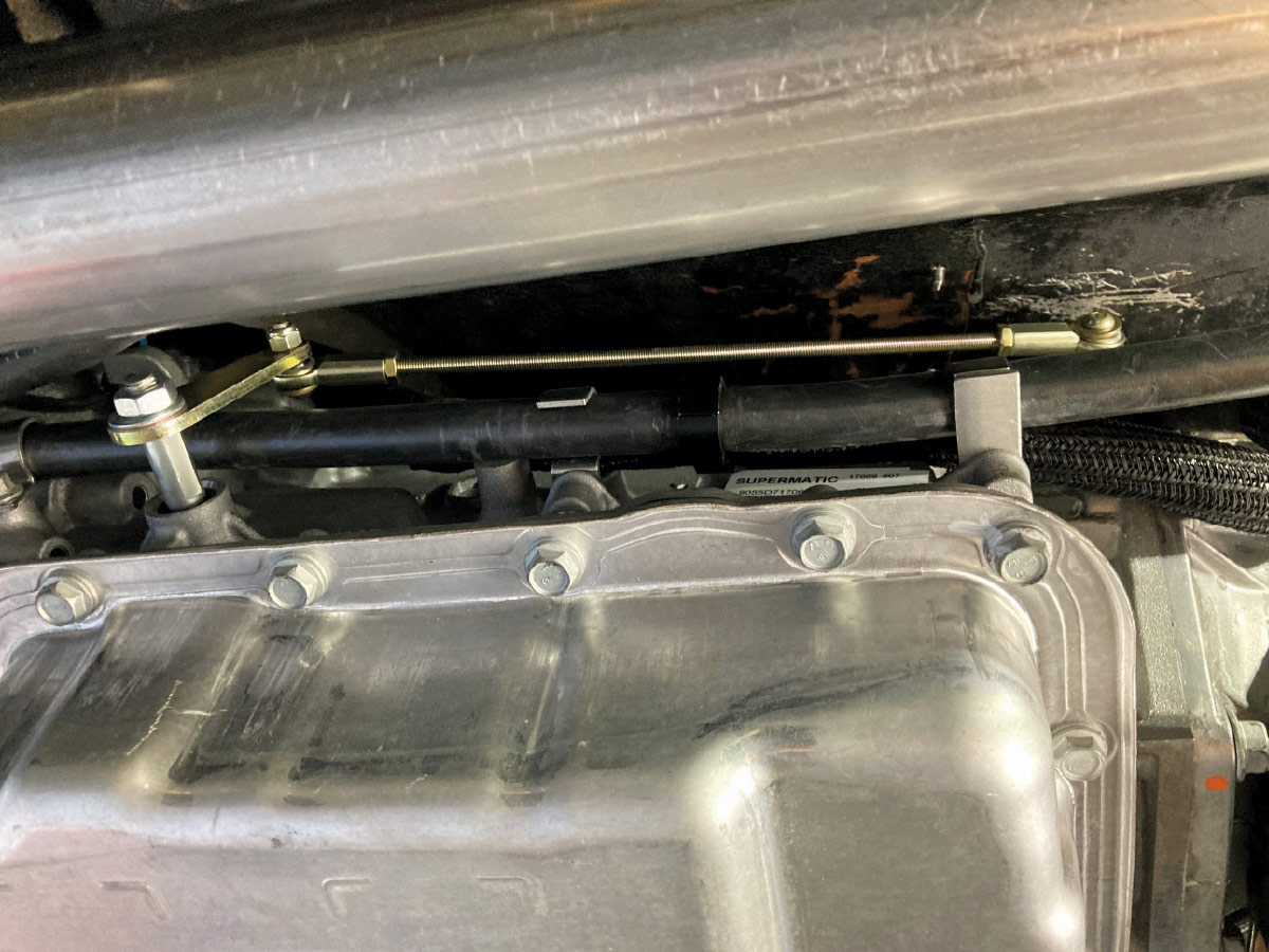 1957 Chevy Lokar shifter undercarriage view showing precision hardware alignment and robust construction