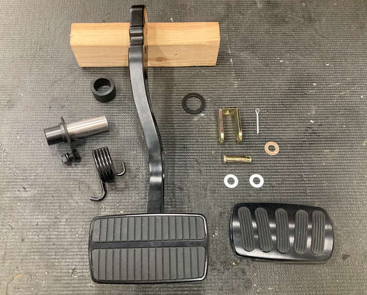 1957 Chevrolet pedal assembly components laid out for installation