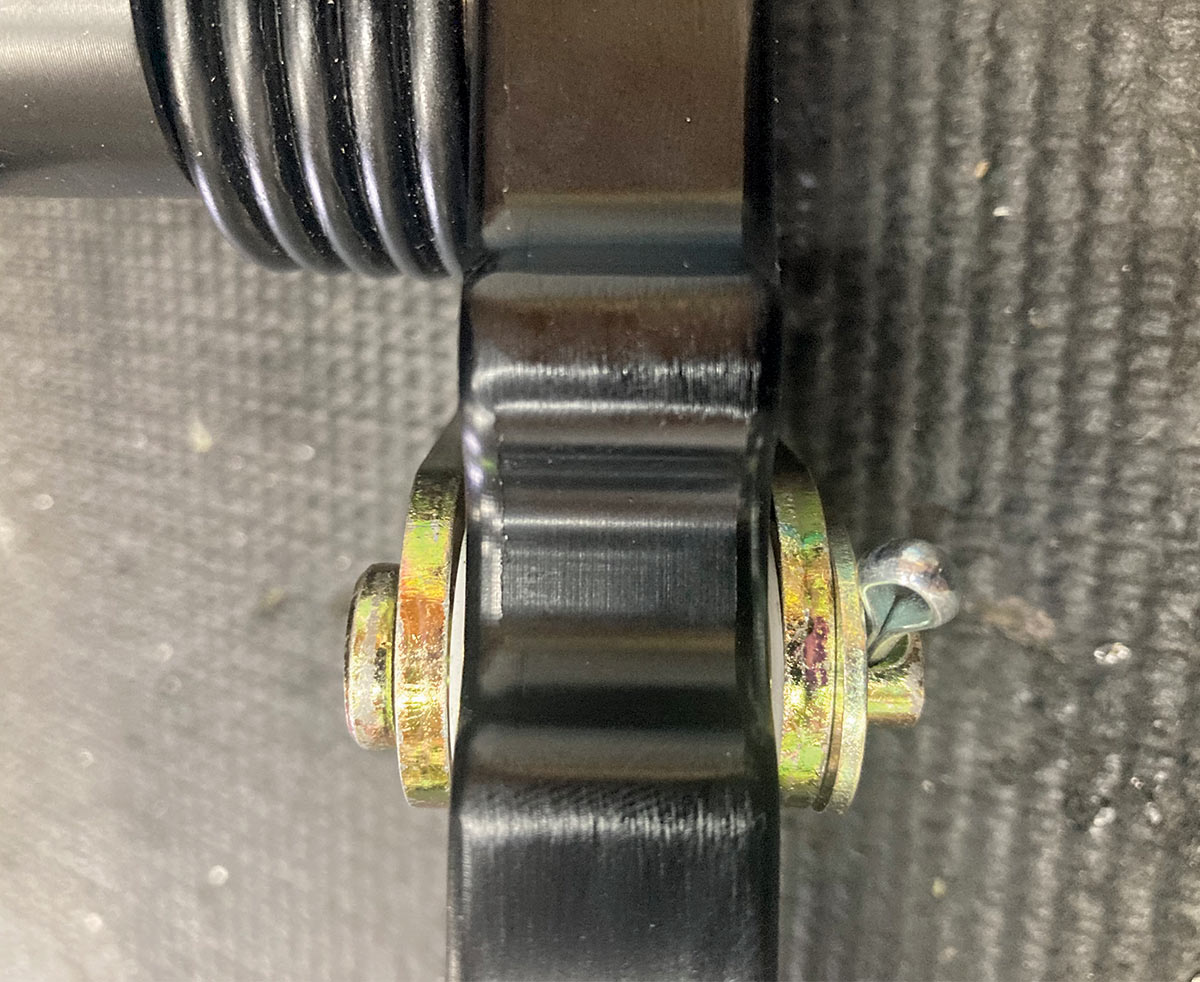 1957 Chevy pedal assembly close-up showing pivot bushing and cotter pin assembly