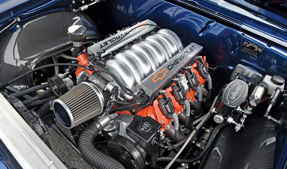 chevy engine under the hood of dark blue 1969 chevy camaro
