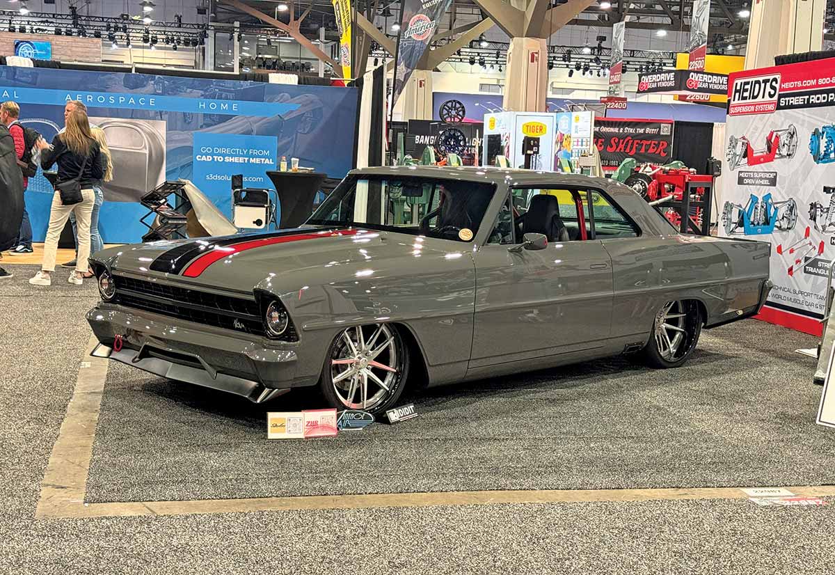 1967 Chevy Nova gray custom with red racing stripes and Heidts suspension at SEMA